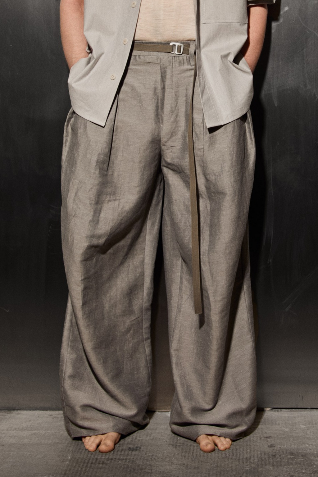 Men pleated pants made from Patternalism sewing pattern #0202 – front view, male model