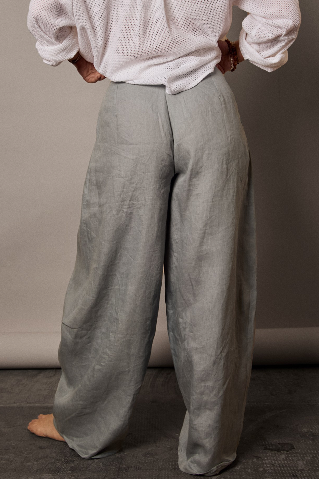 Patternalism pattern #0204 women pleated pants – back view, female model