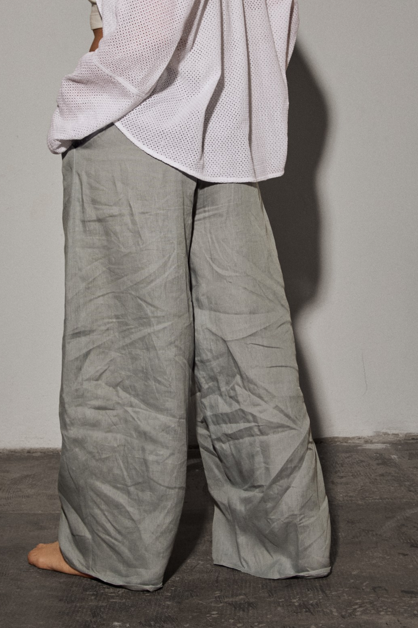 Patternalism pattern #0204 women pleated pants – backside view, female model