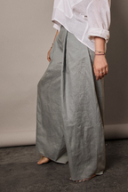 Side view of women pleated pants from Patternalism sewing pattern #0204